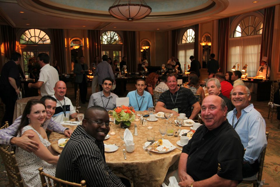 International Pawn Symposium participants gathered around a dinner table at The Ritz-Carlton in Naples in 2011